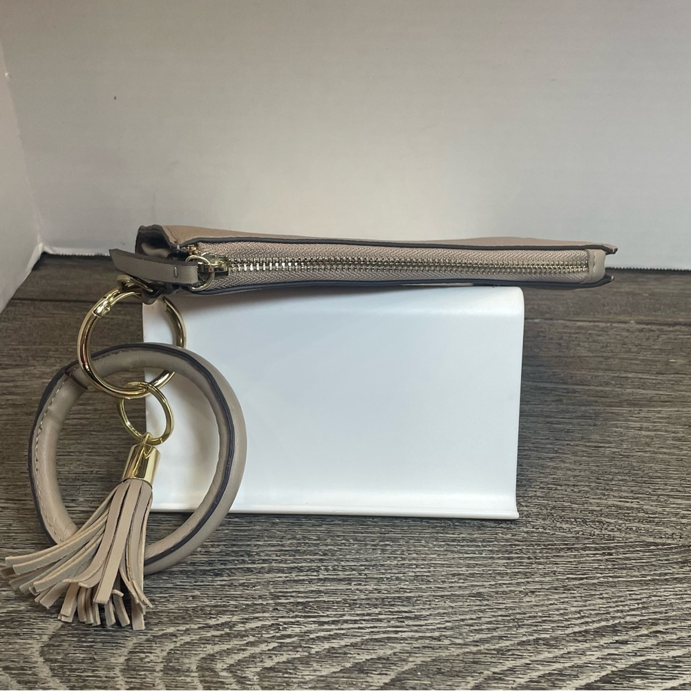 Nanette lepore Tan Clutch with Tassel Accent wristlet. Small flaw on corner - Picture 4 of 9